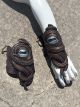 Pair of handmade silicone kraken tentacle gauntlets with glowing blue cyclops eyes and adjustable lace-up arm wraps by Mertailor.